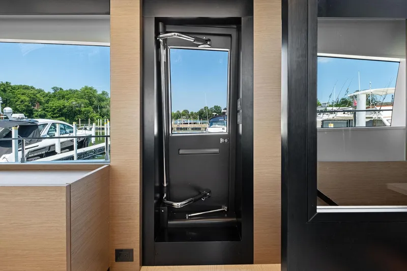 Slide: The Image of Interior view of 2018 Ferretti Yachts 780, showcasing sleek modern design and marina backdrop. - 42