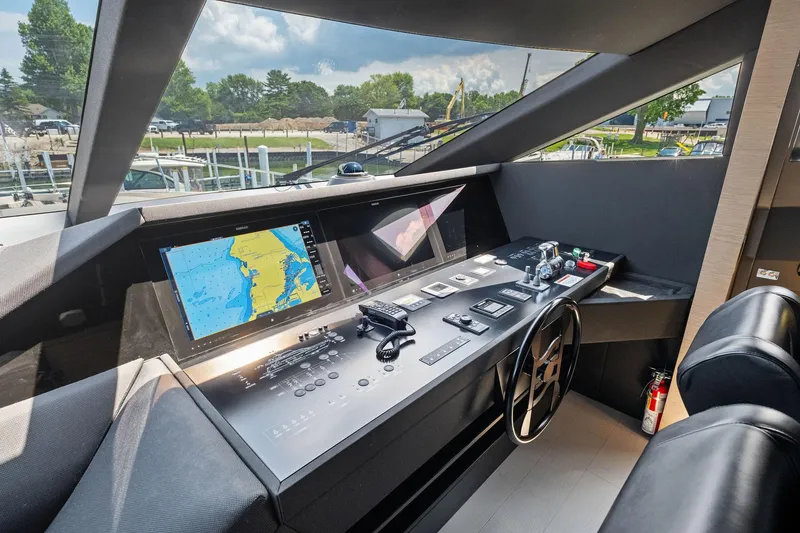 Slide: The Image of Helm of 2018 Ferretti Yachts 780 with navigation screens and controls. - 43