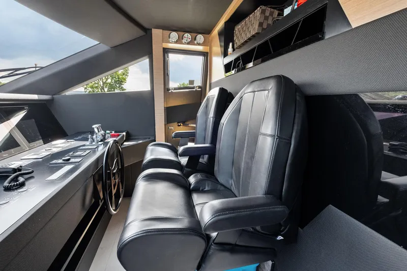 Slide: The Image of Pilot seats and control panel in 2018 Ferretti Yachts 780 cockpit. - 46