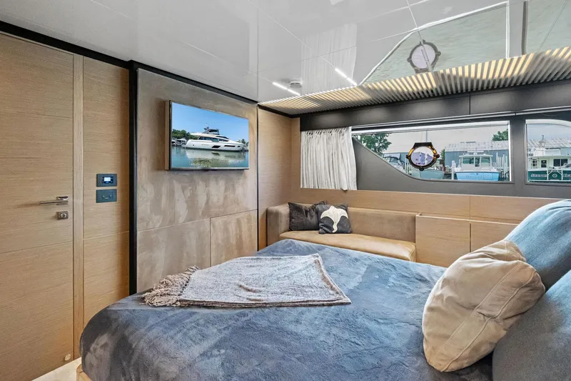 Slide: The Image of Luxurious bedroom interior of 2018 Ferretti Yachts 780 with modern decor and large window. - 49