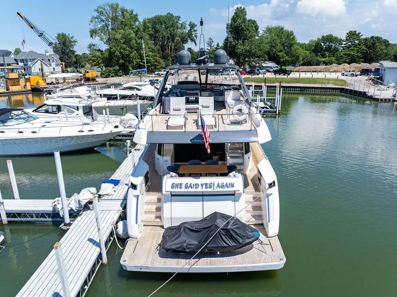 Slide: The Image of 2018 Ferretti Yachts 780 docked, rear view with "She Said Yes! Again" sign. - 6