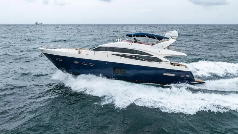 Slide: The Image of 2012 Princess 72 Motor Yacht cruising on open sea. - 14