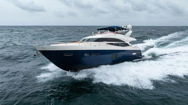 Slide: The Image of 2012 Princess 72 Motor Yacht cruising on open sea under cloudy skies. - 15