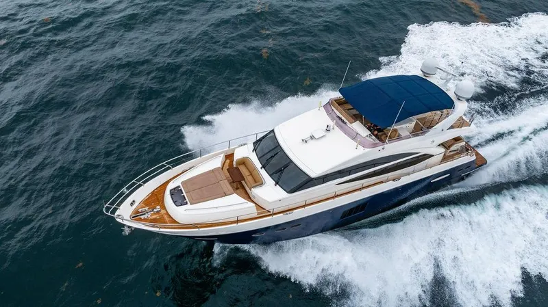 Slide: The Image of Luxurious 2012 Princess 72 Motor Yacht cruising on open water. - 18