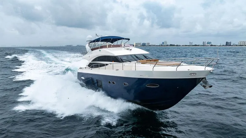 Slide: The Image of Luxurious 2012 Princess 72 Motor Yacht cruising on open water. - 21