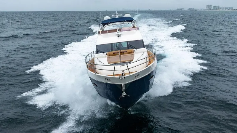 Slide: The Image of 2012 Princess 72 Motor Yacht cruising on open sea, front view. - 22