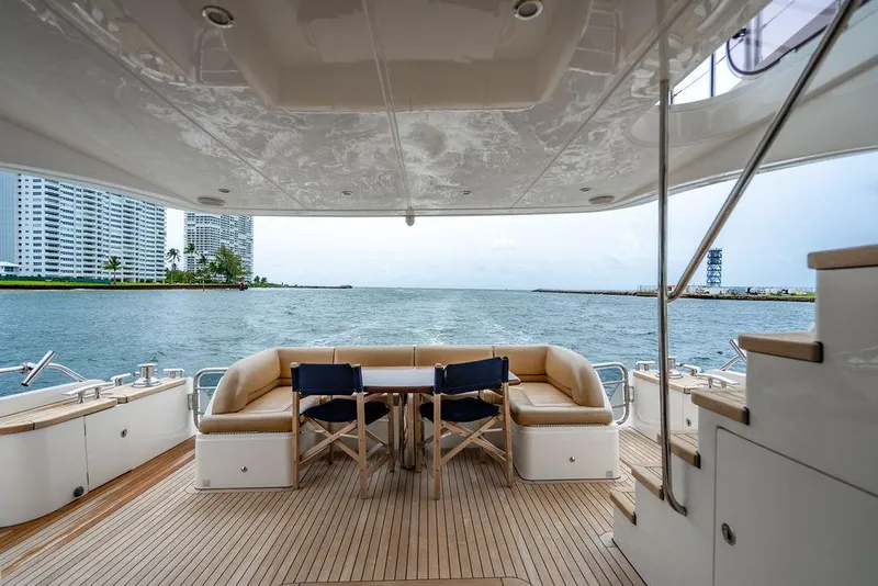 Slide: The Image of Luxurious 2012 Princess 72 Motor Yacht deck with seating, overlooking waterfront and cityscape. - 29