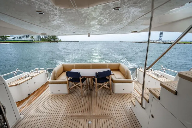 Slide: The Image of Luxurious 2012 Princess 72 Motor Yacht deck with seating, overlooking serene waters. - 30