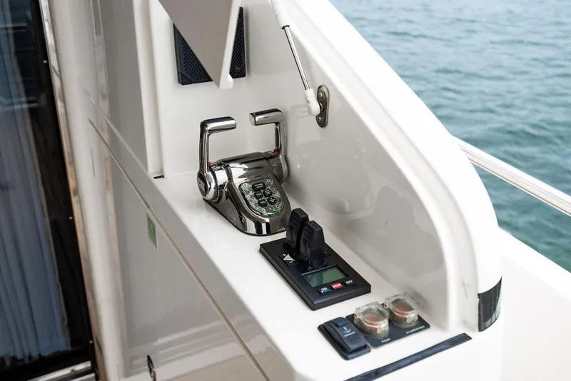 Slide: The Image of Control panel on 2012 Princess 72 Motor Yacht, featuring throttle and navigation controls. - 32