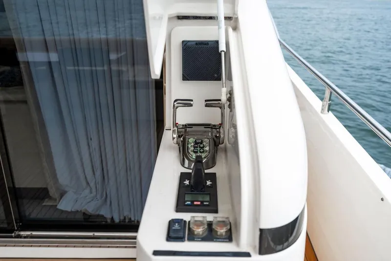 Slide: The Image of Control panel on a 2012 Princess 72 Motor Yacht, overlooking the ocean. - 33