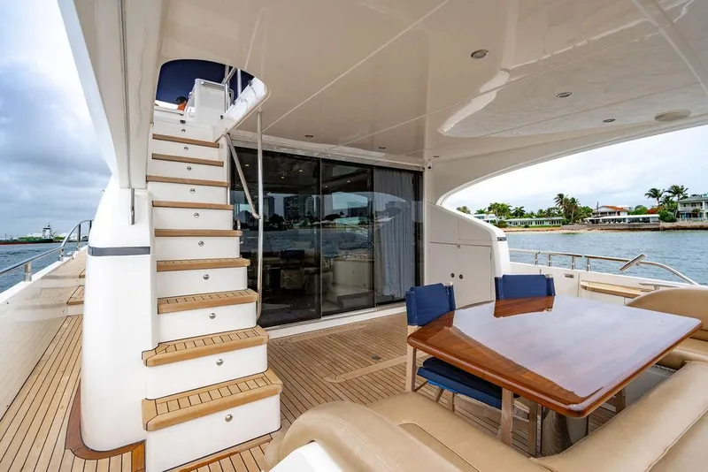 Slide: The Image of Luxurious 2012 Princess 72 Motor Yacht with elegant outdoor seating and staircase. - 36