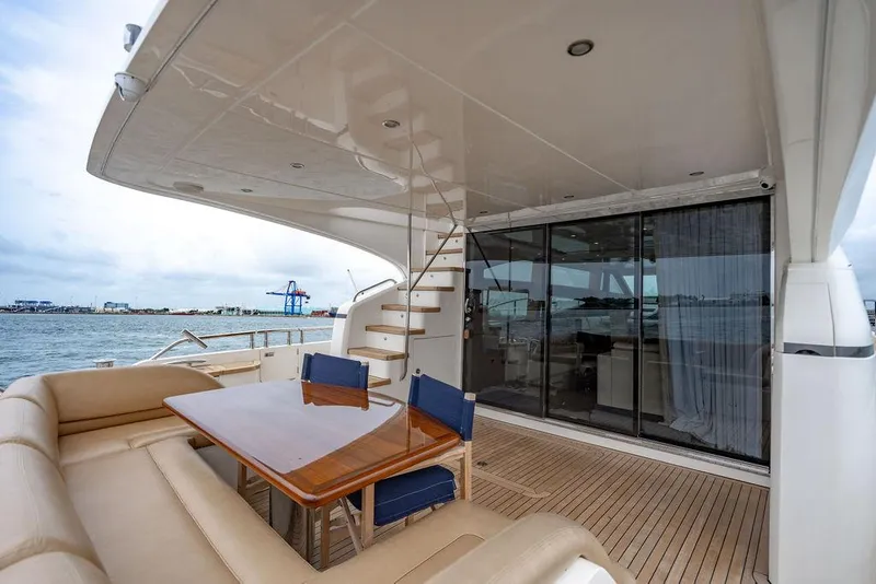 Slide: The Image of Luxurious 2012 Princess 72 Motor Yacht with elegant outdoor seating and ocean view. - 38