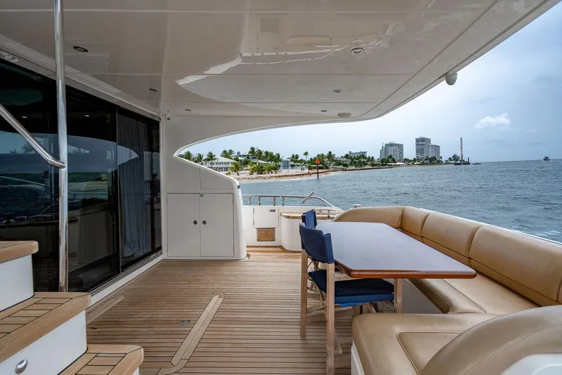 Slide: The Image of Luxurious 2012 Princess 72 Motor Yacht deck with seating, ocean view, and coastal backdrop. - 39
