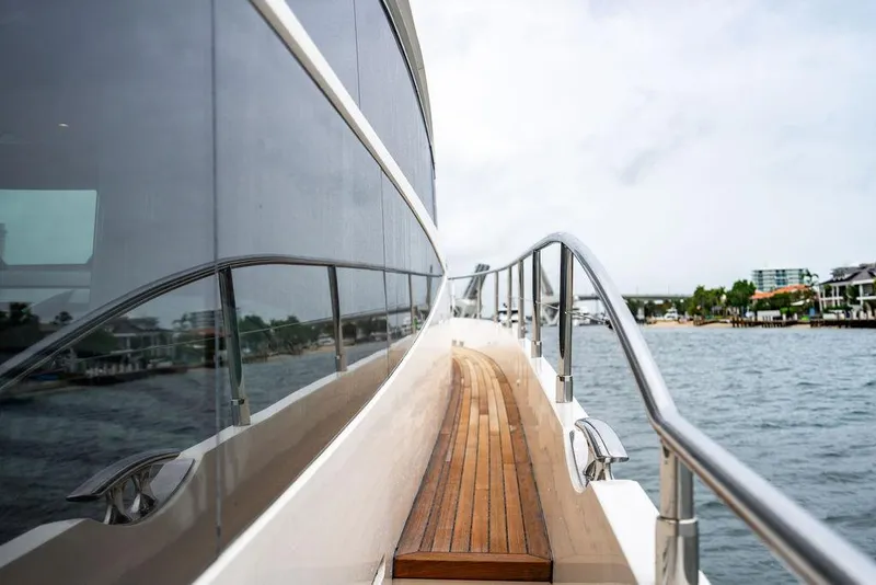Slide: The Image of Side view of a 2012 Princess 72 Motor Yacht with wooden deck and railing. - 42