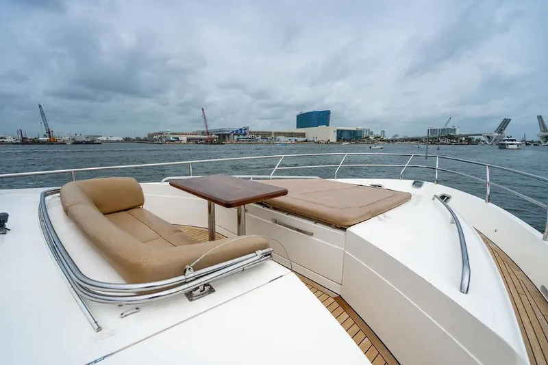 Slide: The Image of Luxurious 2012 Princess 72 Motor Yacht with spacious deck seating and table, docked in marina. - 43