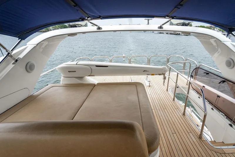 Slide: The Image of Luxurious 2012 Princess 72 Motor Yacht deck with sunbed and ocean view. - 49