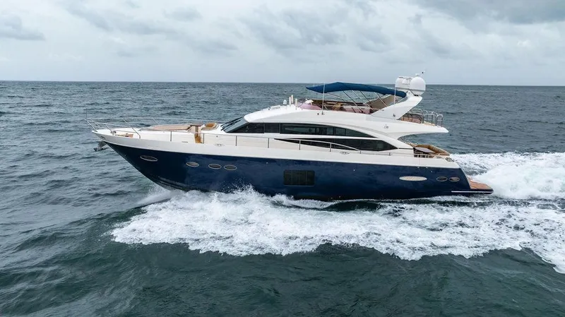 Slide: The Image of 2012 Princess 72 Motor Yacht cruising on open sea under cloudy skies. - 6