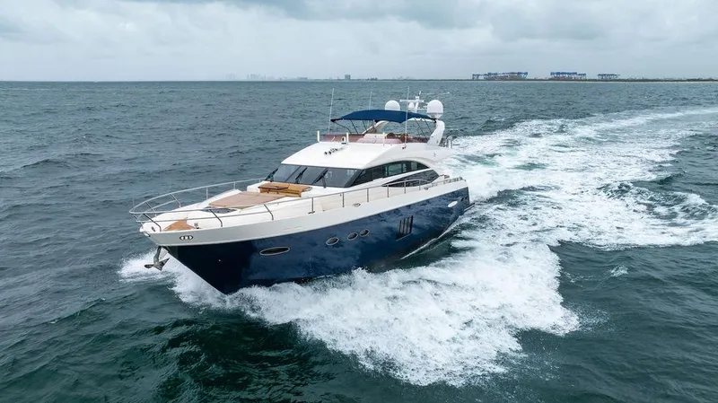 Slide: The Image of 2012 Princess 72 Motor Yacht cruising on open sea under cloudy skies. - 7