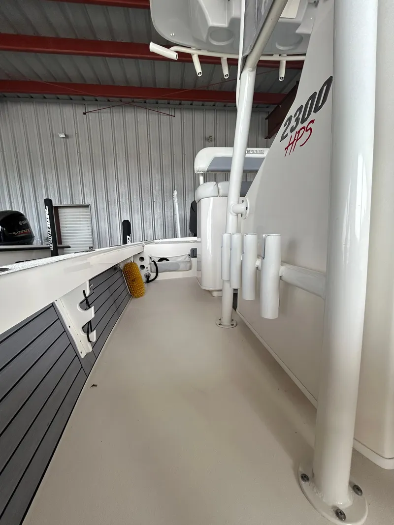 Slide: The Image of 2023 Pathfinder 2300 HPS boat wiring and battery setup with charger and cables. - 10