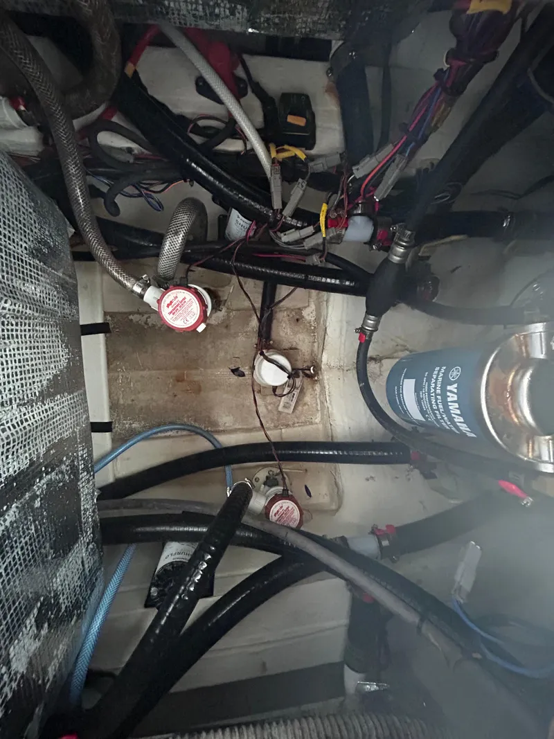 Slide: The Image of Open storage compartment on 2023 Pathfinder 2300 HPS boat, showcasing interior space. - 14