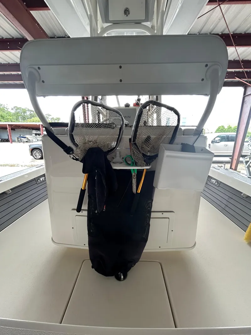 Slide: The Image of Engine compartment of a 2023 Pathfinder 2300 HPS boat with visible wiring and components. - 15