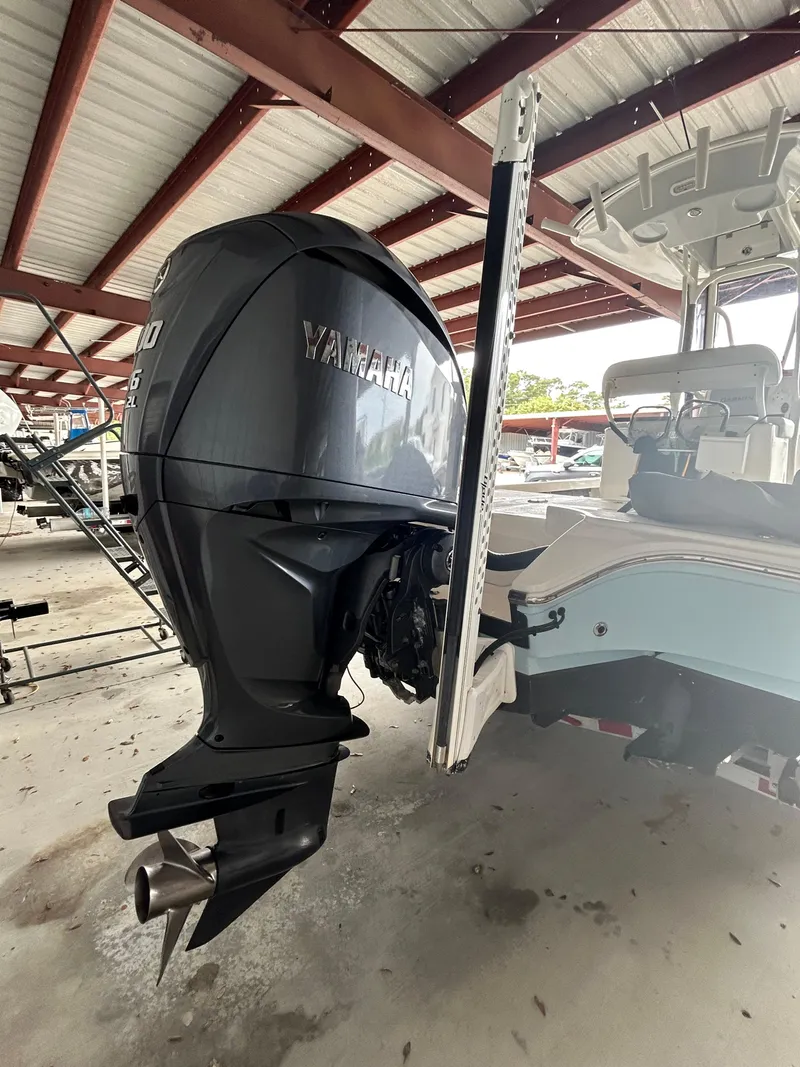 Slide: The Image of 2023 Pathfinder 2300 HPS boat with Yamaha 300 V6 engine in covered storage. - 18