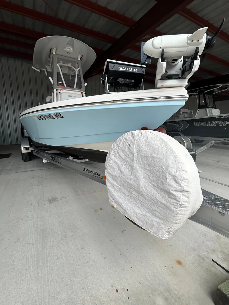 Slide: The Image of 2023 Pathfinder 2300 HPS boat on trailer in covered storage area. - 24