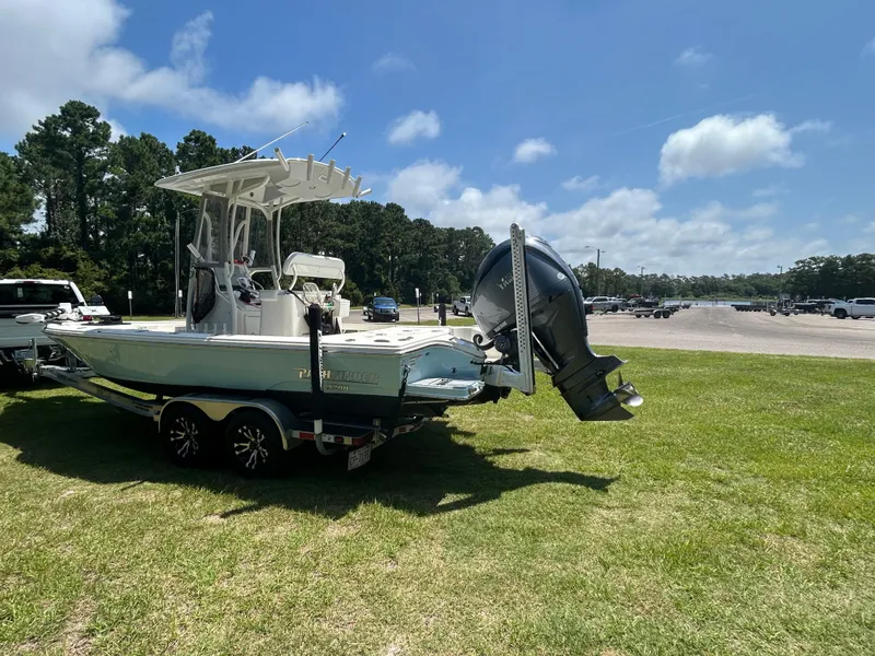 Slide: The Image of 2023 Pathfinder 2300 HPS boat on trailer in sunny outdoor setting. - 37