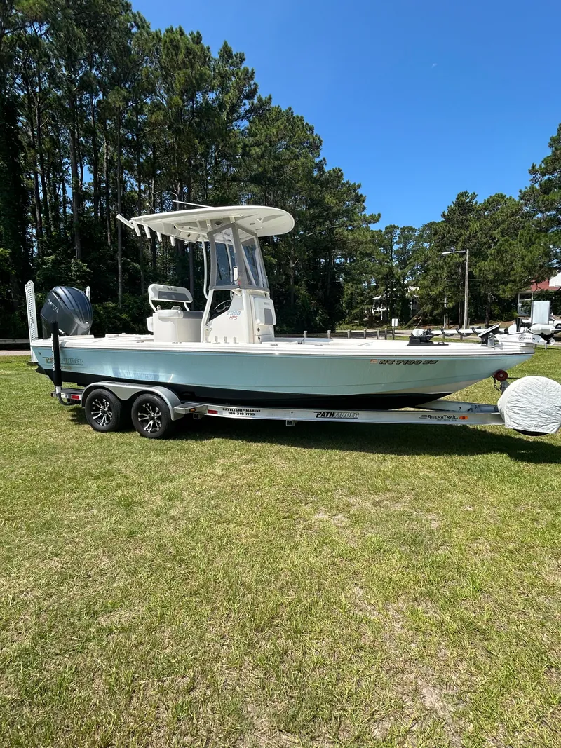 Slide: The Image of 2023 Pathfinder 2300 HPS boat console with steering wheel and controls. - 40
