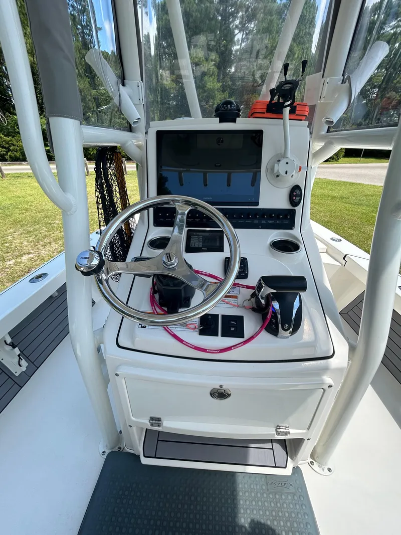 Slide: The Image of Control panel of 2023 Pathfinder 2300 HPS boat with Garmin display and switches. - 41