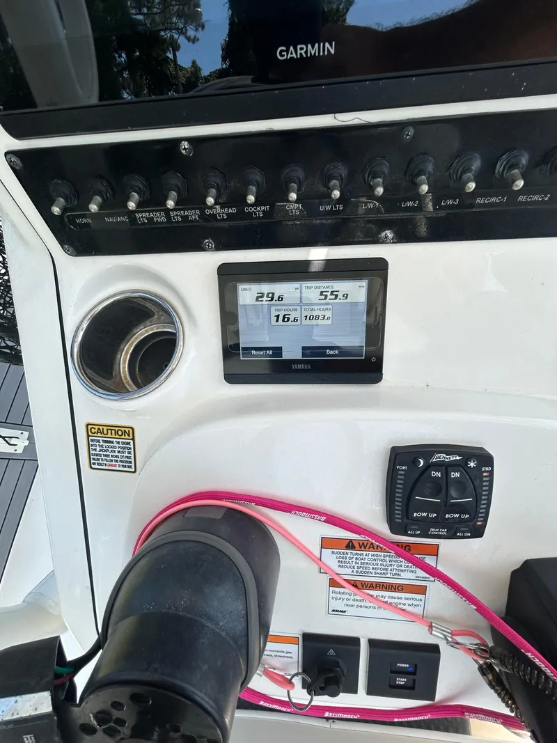 Slide: The Image of 2023 Pathfinder 2300 HPS boat storage compartments open, showcasing interior space and organization. - 42