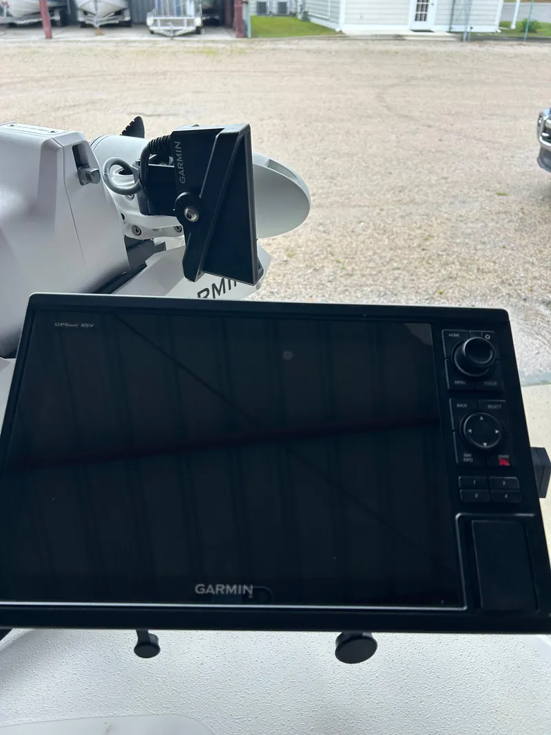 Slide: The Image of 2023 Pathfinder 2300 HPS boat bow with trolling motor, parked in a lot. - 7