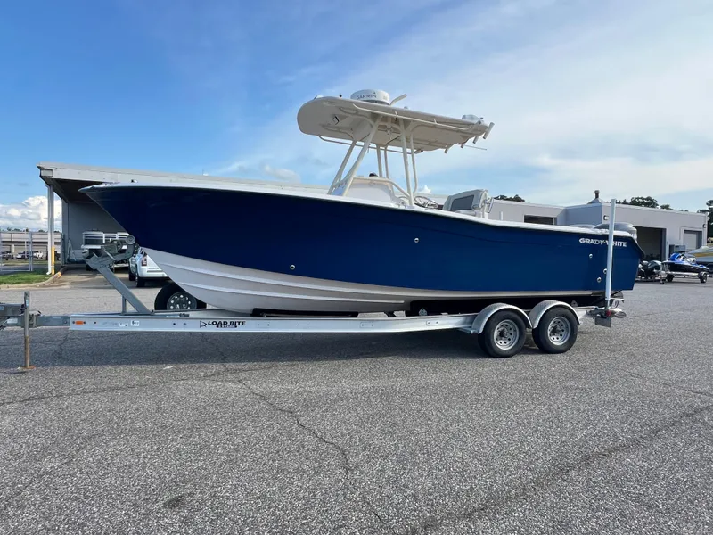 Slide: The Image of 2002 Grady-White Chase 273 boat on trailer, parked outdoors, side view. - 11