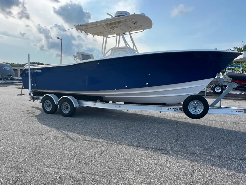 Slide: The Image of 2002 Grady-White Chase 273 boat on trailer, parked outdoors, sunny day. - 16