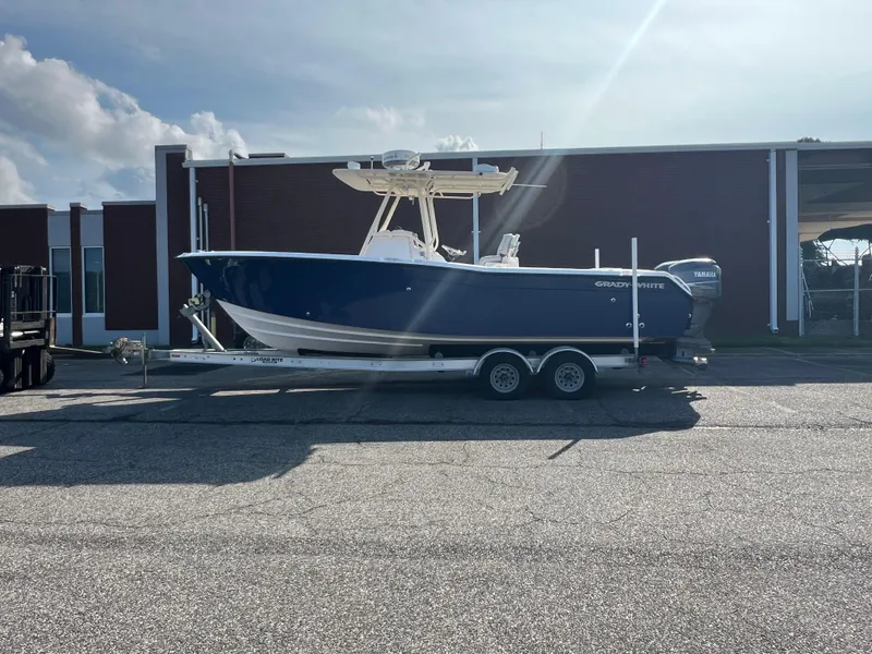 Slide: The Image of 2002 Grady-White Chase 273 boat with twin Yamaha engines, parked outdoors. - 22