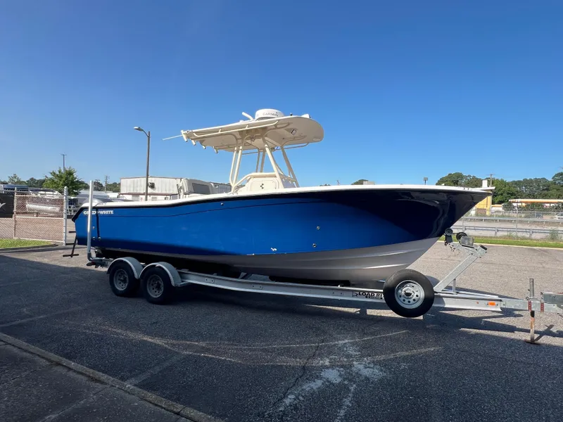 Slide: The Image of 2002 Grady-White Chase 273 boat on trailer with Yamaha engine, parked outdoors. - 27
