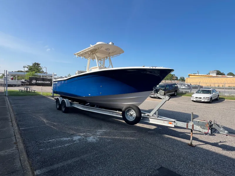 Slide: The Image of 2002 Grady-White Chase 273 boat with dual Yamaha outboard motors on a trailer. - 28