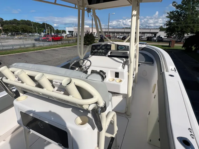 Slide: The Image of Console of 2002 Grady-White Chase 273 boat with navigation screens and gauges. - 33