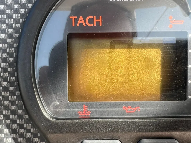 Slide: The Image of 2002 Grady-White Chase 273 boat interior with sink and storage compartments. - 35