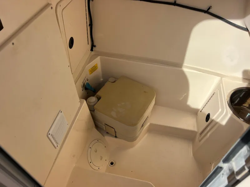 Slide: The Image of 2002 Grady-White Chase 273 boat with gray cushioned seating in the bow area. - 37