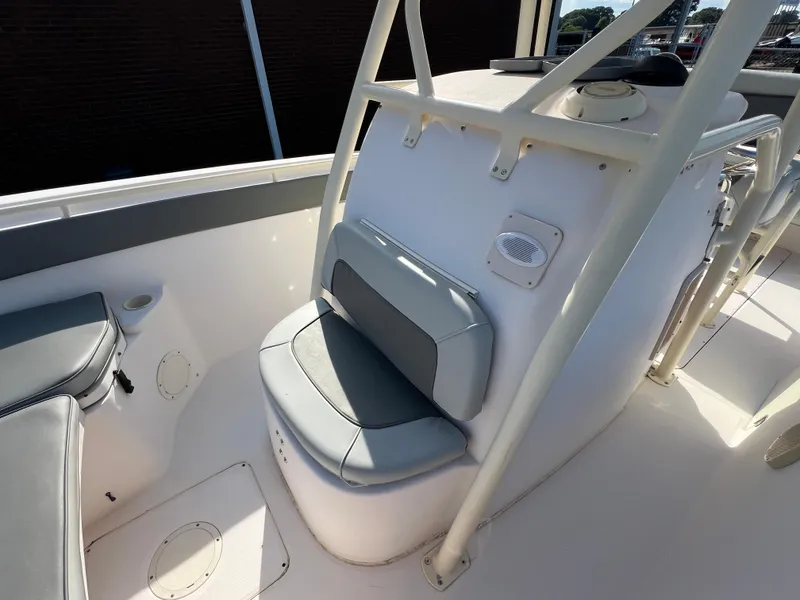 Slide: The Image of 2002 Grady-White Chase 273 boat interior, showcasing sleek white side panel and seating. - 42