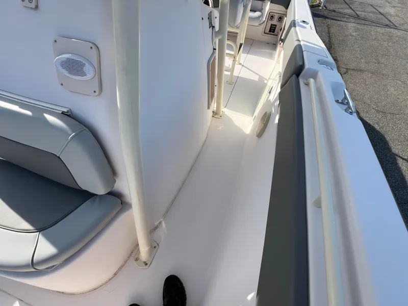 Slide: The Image of 2002 Grady-White Chase 273 boat interior with seating and dual engines. - 44