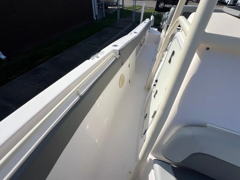 Slide: The Image of 2002 Grady-White Chase 273 boat interior, featuring seating and control panel. - 45