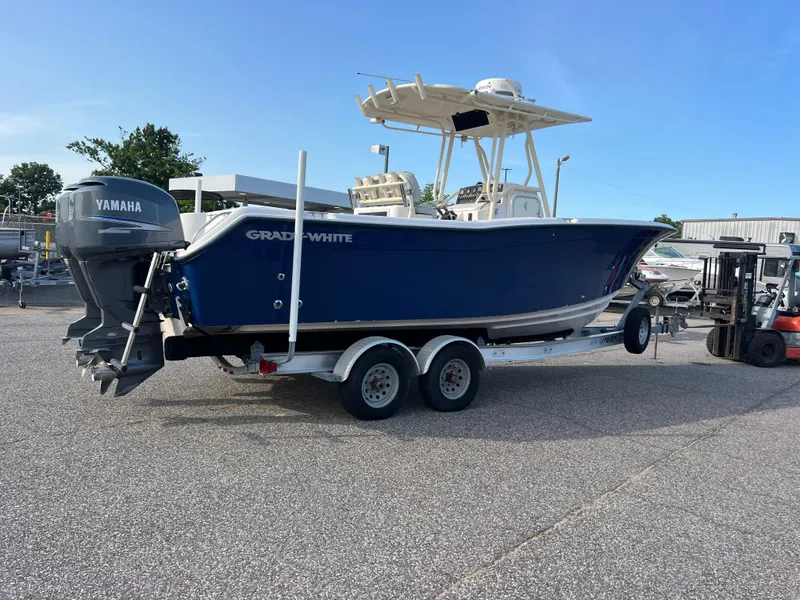 Slide: The Image of 2002 Grady-White Chase 273 boat with dual Yamaha engines on a trailer. - 5