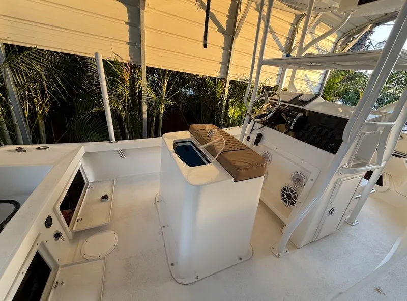 Slide: The Image of 2003 Storm Boats 21 interior with helm, seating, and storage compartments. - 5