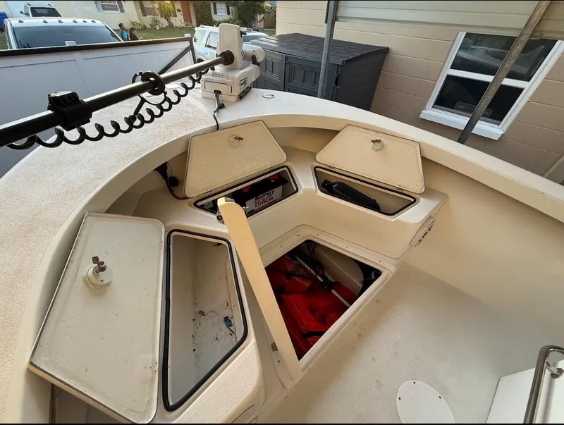 Slide: The Image of 2003 Storm Boats 21 model with open storage compartments and equipment. - 7