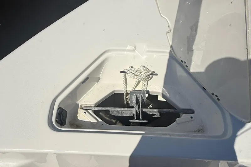 Slide: The Image of Anchor compartment of 2023 Key West 203 FS boat with rope and shadow. - 10
