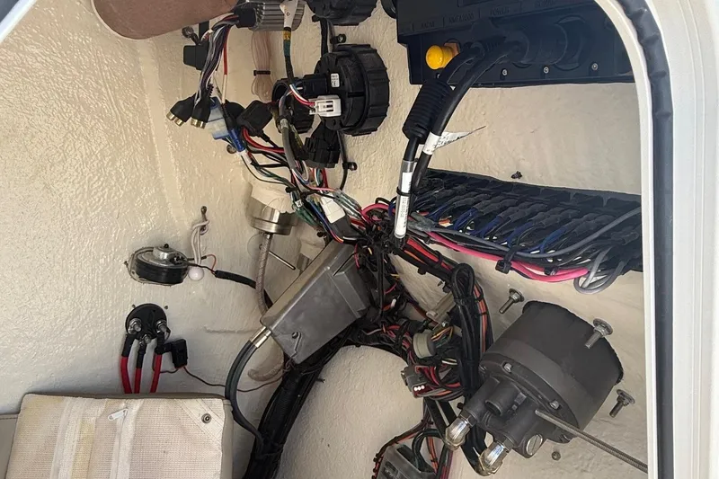 Slide: The Image of Electrical wiring and components inside a 2023 Key West 203 FS boat. - 17