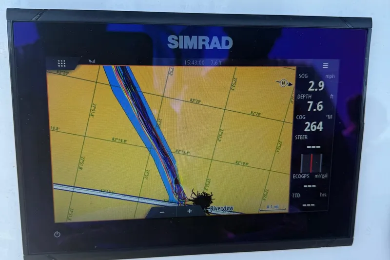 Slide: The Image of Simrad navigation display on 2023 Key West 203 FS boat, showing speed and depth data. - 18