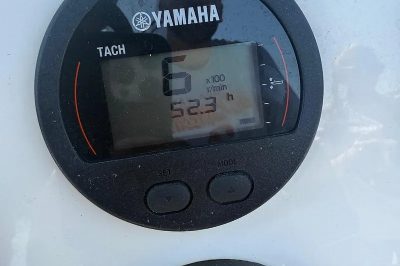 Slide: The Image of Yamaha tachometer displaying 6 RPM and 52.3 hours on Key West 203 FS, 2023 model. - 19